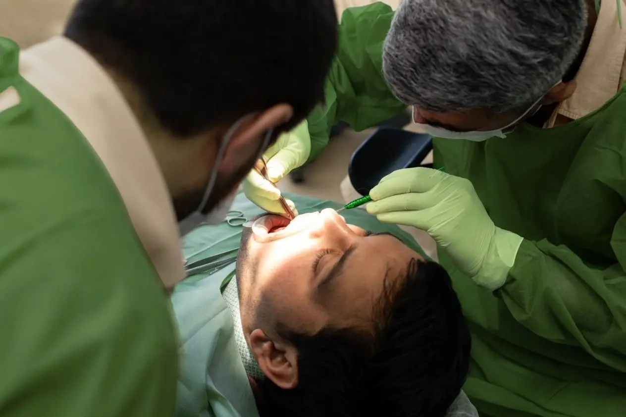 OPAL Dental Group dentist performing advanced dental examination and patient care in Paramount, California